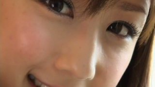 Hot and cute brunette Yuko Ogura sits on the couch and talks too much